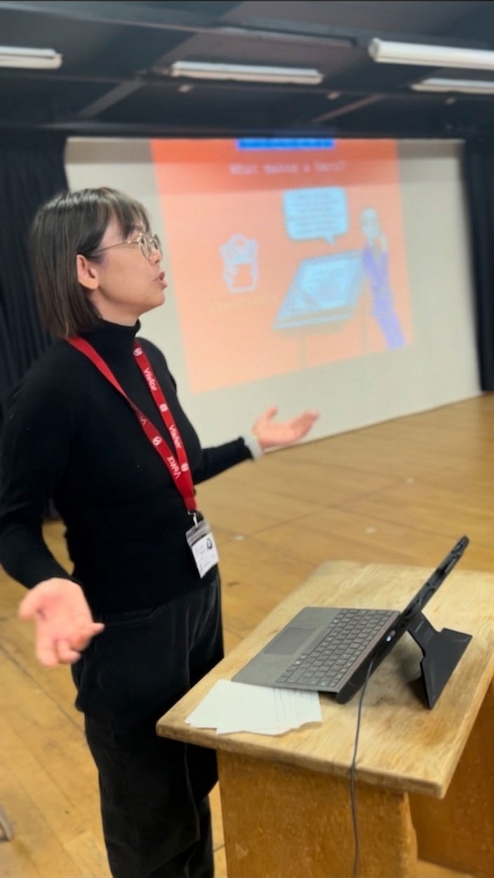 Shiny Leung presenting Heroes from the East at a school visit